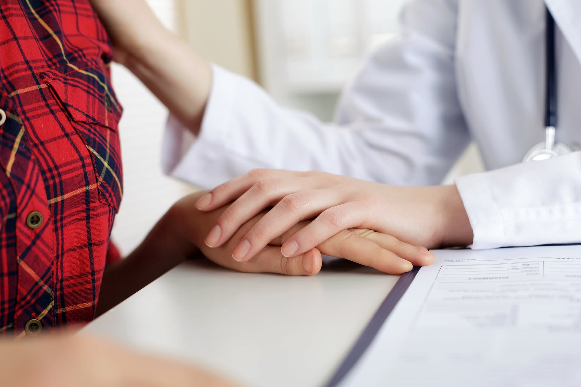 pleasnt woman in room with doctor 800
